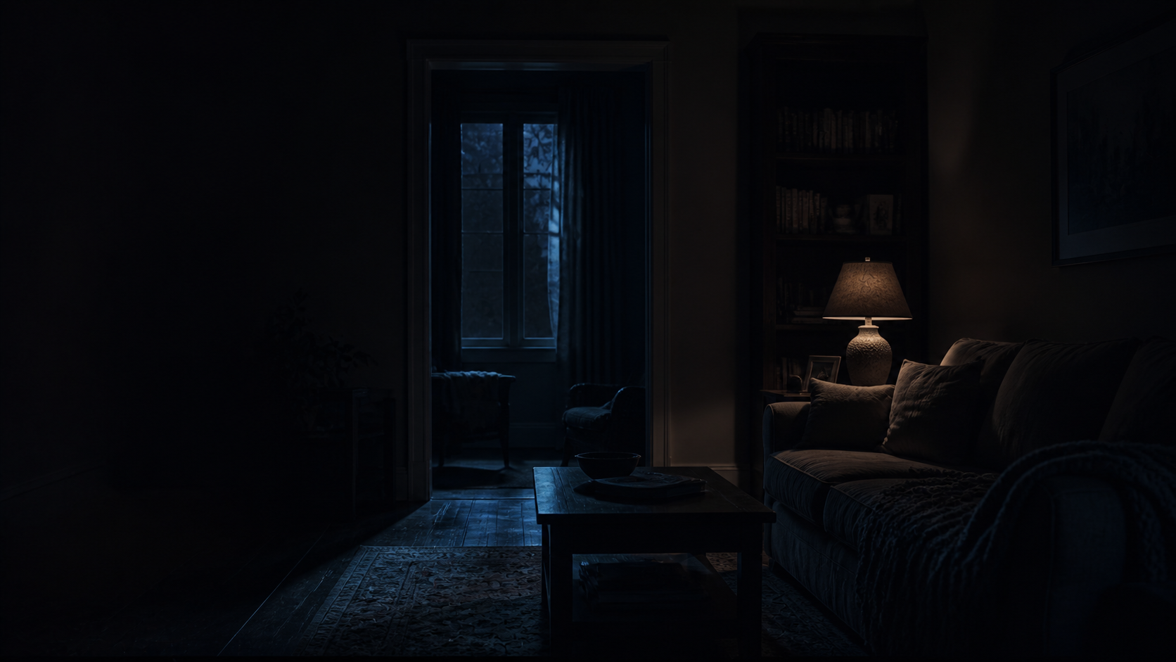 Familiar room at night with furniture transformed by low light